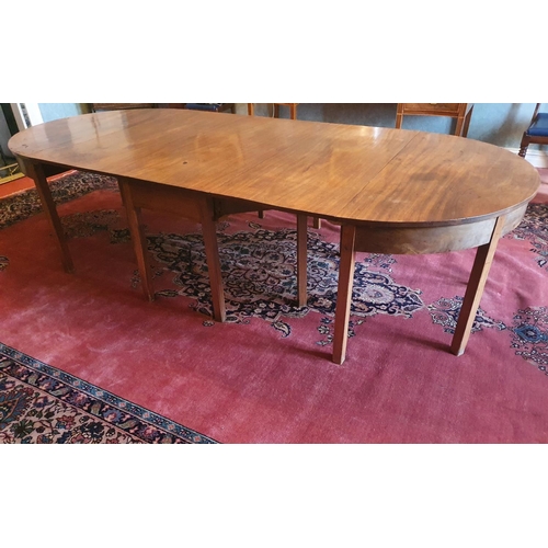 131 - A Georgian Mahogany Dining room Table of simple form with two extra leaves on square supports and wi... 