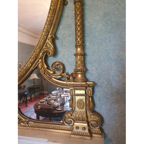 136 - A Most Magnificent 19th Century Timber and Plaster Gilt Overmantel Mirror. The oval centre supported... 