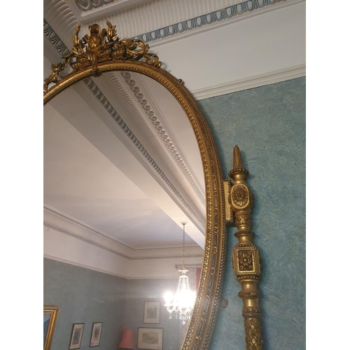 136 - A Most Magnificent 19th Century Timber and Plaster Gilt Overmantel Mirror. The oval centre supported... 