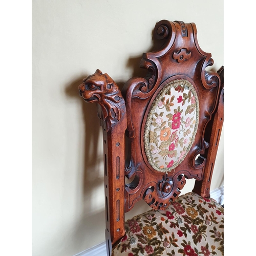 45 - A really good 19th Century Irish Oak Hall Chair with a X frame base, gargoyle support at carved back... 