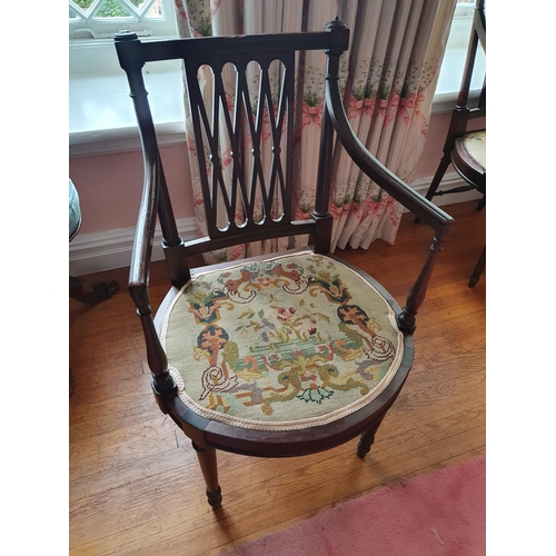 70 - A good set of eight Mahogany Elbow Chairs with lattice backs tapered supports and arms and tapestry ... 