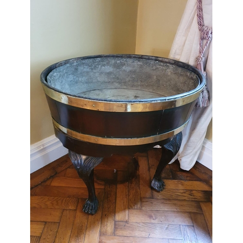 71 - A really good Georgian Irish Wine Cooler with brass crossbanded top on hairy paw supports. 64 x 46 x... 