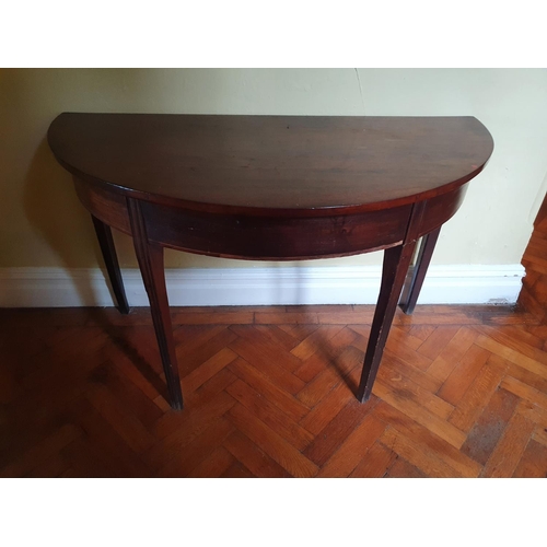 72 - An early 19th Century Mahogany half moon Side Table on moulded tapered supports. W121 x 60 x H71cm a... 