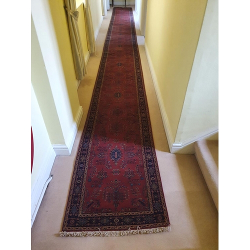 522 - A large Terracotta ground very fine handwoven Indian Runner with traditional floral medallion design... 