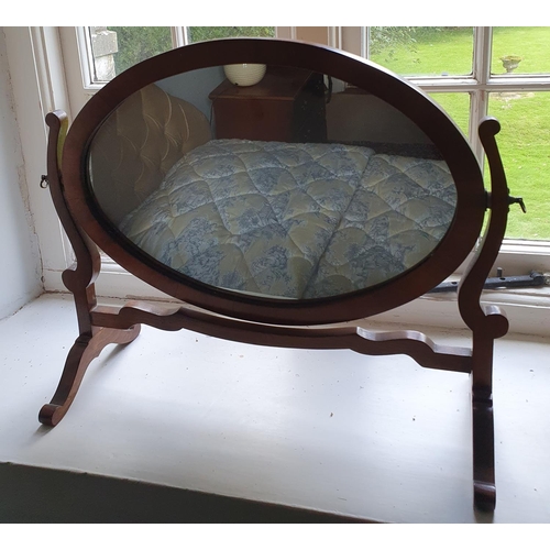 528 - An Edwardian Mahogany oval Crutch Mirror. H45 x D21 x W51cm approx.