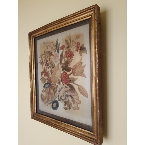 542 - A 19th Century Tapestry of Flowers in original gilt frame. 45 x 39cm approx.