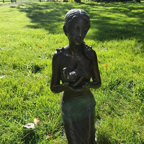 751 - A really good Bronze Figure of a Girl kneeling with a bird in her hand. H59cm approx.