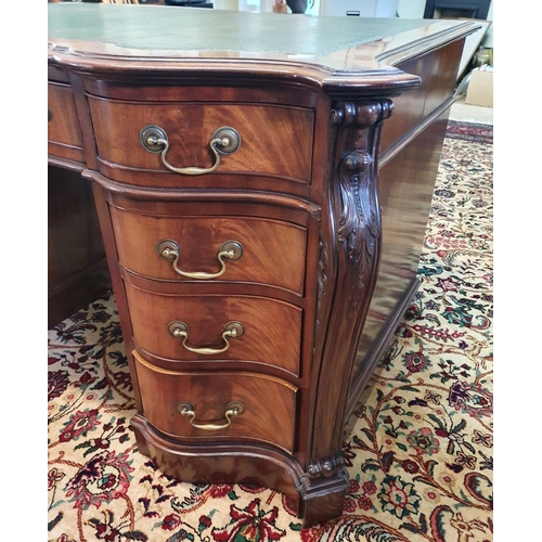 665 - A 19th Century Mahogany and Veneered half moon fold over Card Table, the top is veneered in a sunbur... 