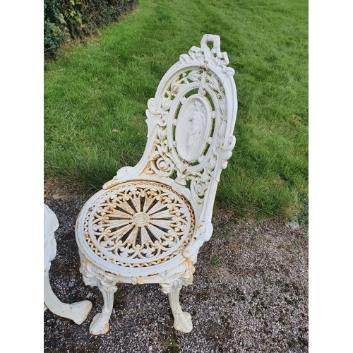 759 - A fabulous heavy cast iron set of three Chairs and Table with pierced outline.