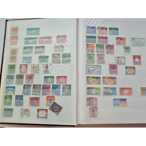 63 - A Stock Book of German Stamps along with another of Finland Stamps.