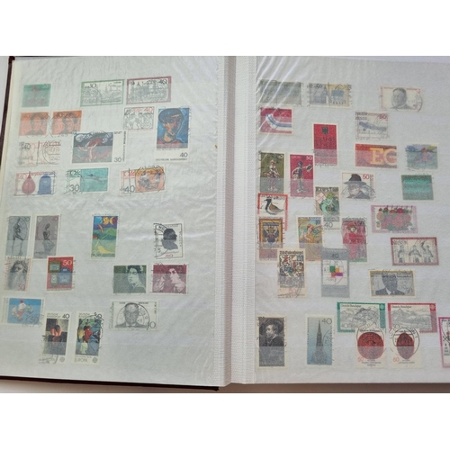 63 - A Stock Book of German Stamps along with another of Finland Stamps.