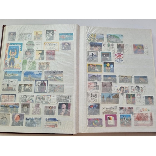 63 - A Stock Book of German Stamps along with another of Finland Stamps.