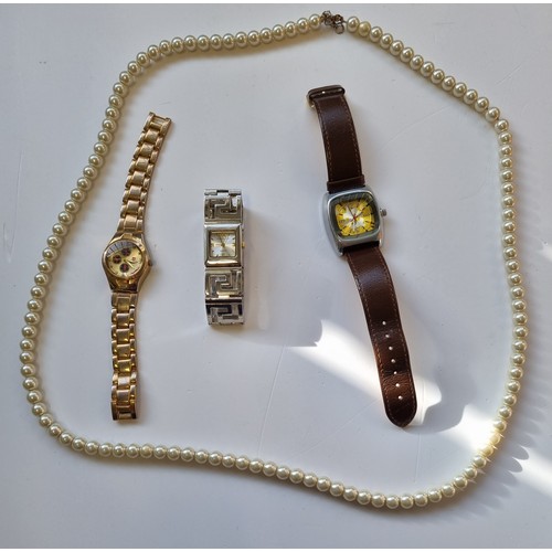 106 - A large Pearl Necklace along with three Watches.