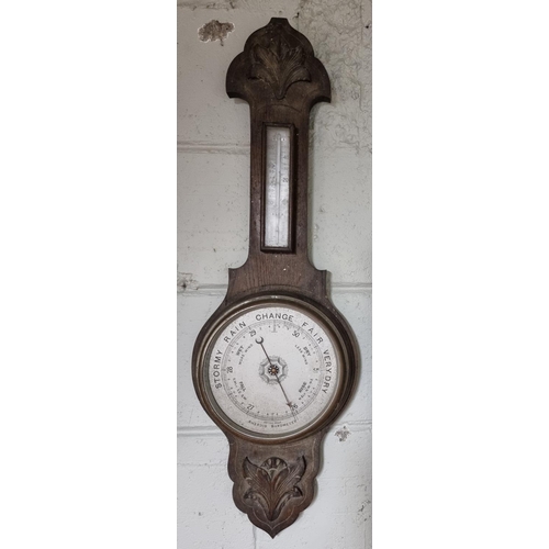 139 - An Edwardian Oak Barometer.