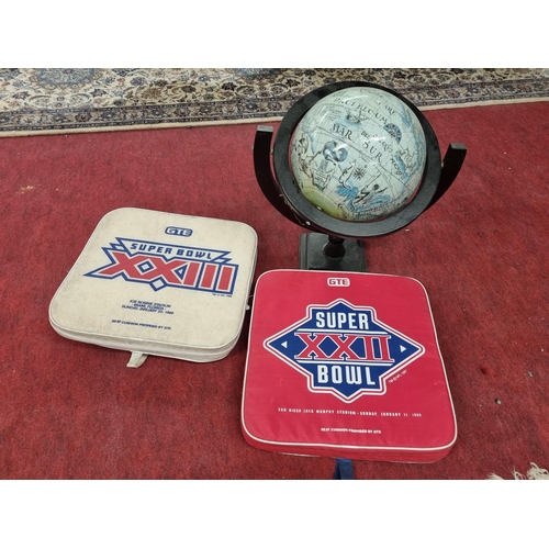 158 - A table top Globe along with two Super Bowl Seat Cushions from 1988 and 1989 Super Bowl.