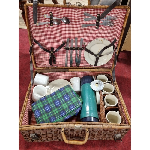 162 - A vintage Picnic Basket and contents.