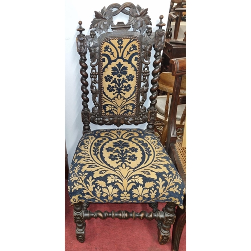 52 - A 19th Century Oak Hall Chair with highly pierced back and upholstered seat on barley twist supports... 