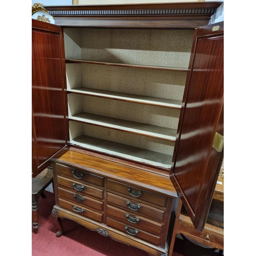 92 - A good early 20th Century Mahogany Cupboard with shelved interior top and a bank of eight drawers an... 