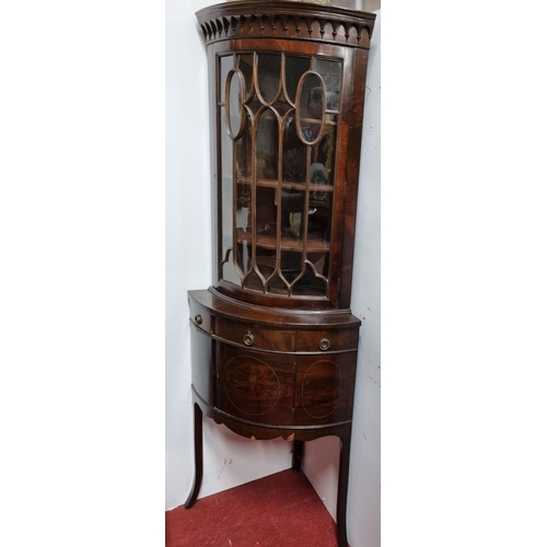 102 - A late 19th early 20th Century bow fronted Corner Cabinet with glazed top and single panelled door t... 