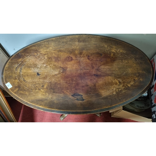 71 - A 19th Century oval Walnut Supper Table with inlaid top and pod base. (slight repair required on top... 