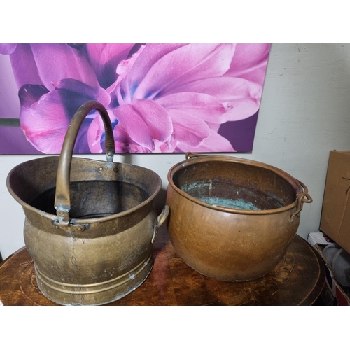 81 - A 19th Century Copper Cauldron along with a 19th Century brass coal scuttle.