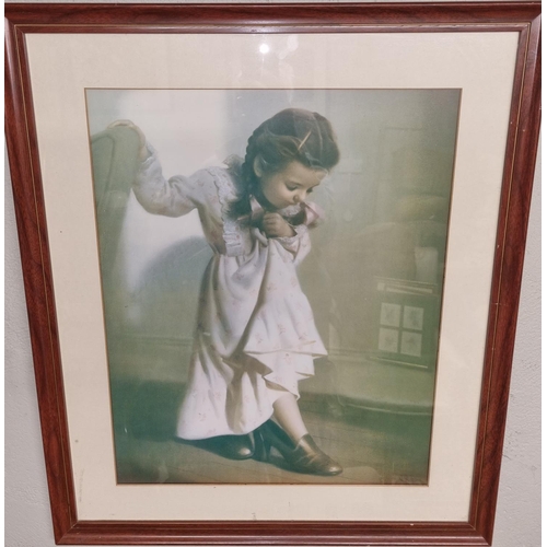 89 - A coloured Print of a young girl trying on her mother's shoes. 66 x 55 cm approx.