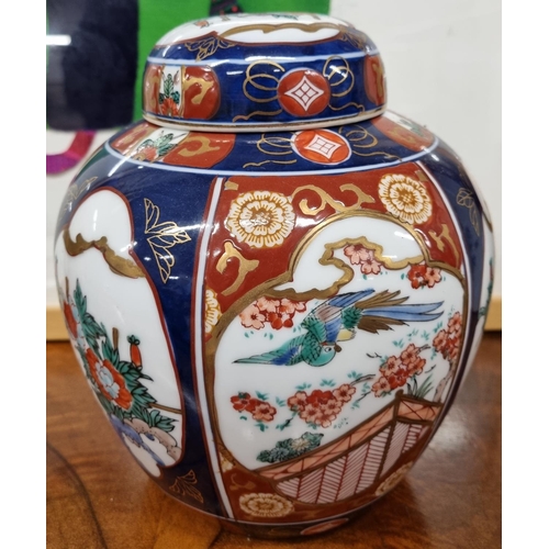 715 - A large Oriental Ginger Jar with hand painted decoration. H 21 cm approx.