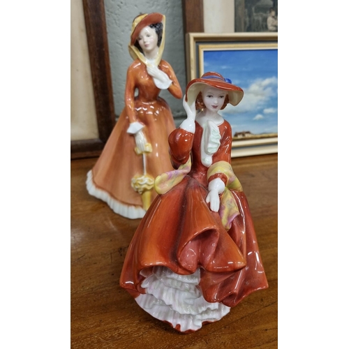 726 - A Royal Doulton Figure of 'Top Of The Hill' along with a Royal Doulton figure of 'Julia'.