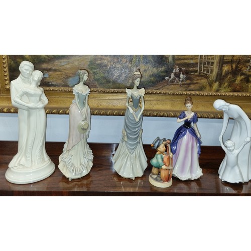 722 - Two Candle Holders. H 43 cm approx along with a Royal Doulton Images Figure 'First Step' along with ... 