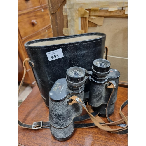 693 - A good pair of Tecnar Binoculars. In leather case.