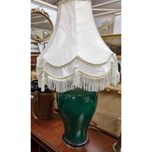 695 - A good green bulbous Table Lamp. H 34 cm approx.