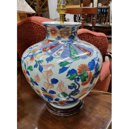 699 - A large bulbous Oriental style Table Lamp. H 32 cm approx.