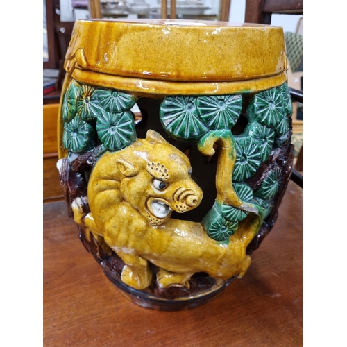 704 - A good Majolica seat depicting an angry tiger and lotus leaves. D 23 x H 39 cm approx.