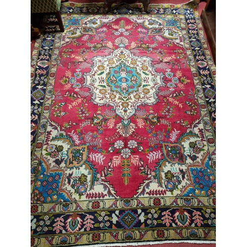 740 - A Persian Carpet with Blue and Red Ground. 270 X 190 cm approx.