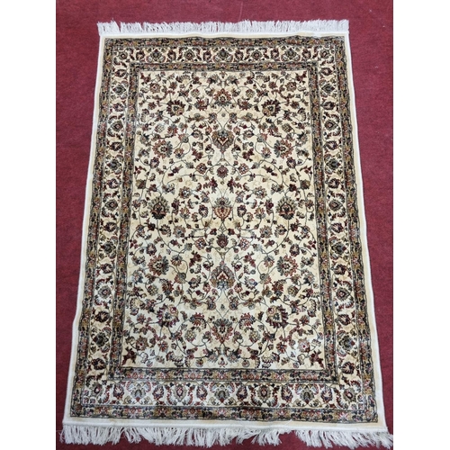 752 - An Ivory ground Cashmere style Rug. 180 x 118 cm approx.