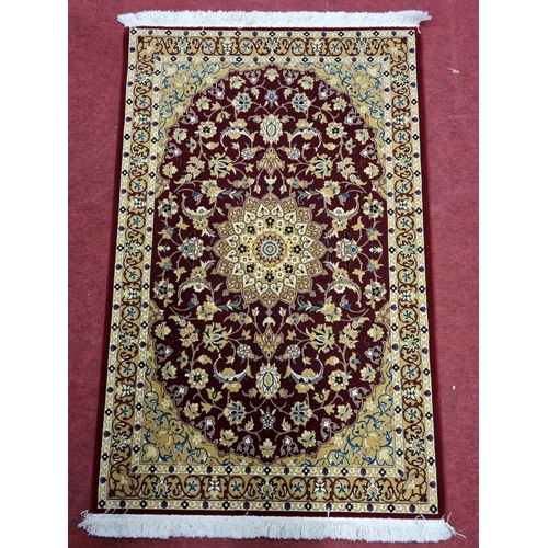 753 - A rich Red ground full pile Turkish Rug with lozenge medallion design. 164 x 100 cm approx.