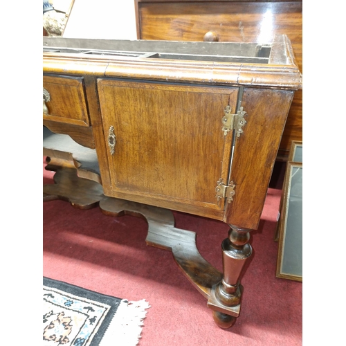 77 - A 19th Century possibly earlier walnut Base, fitted with an arrangement of drawers and cupboards, un... 