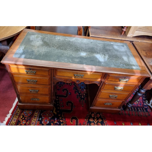 575 - A really fine late 19th Century Mahogany Desk with inset leather top over an arrangement of nine fri... 