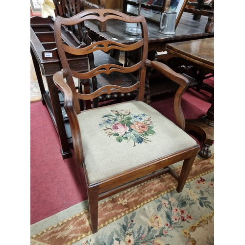594 - A 19th Century Mahogany ladderback Carver with tapestry upholstered seat. W 59 x SH 43 cm approx.