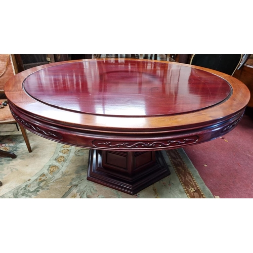 647 - A very large circular Oriental Dining Table with central circular spinning top on rectangular base. ... 