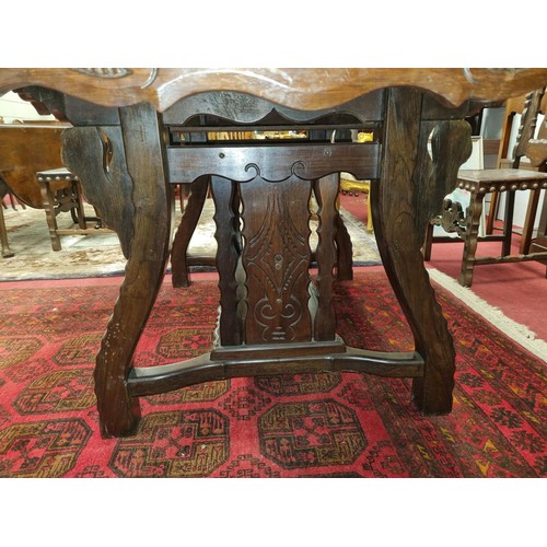 653 - A 20th Century Hardwood Dining room suite consisting of a pull out Table with two leaves H 77 x D 92... 