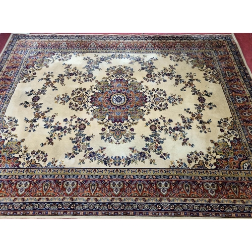 67 - A yellow ground Carpet with foliate decoration, stepped border, 362cm x 275cm.