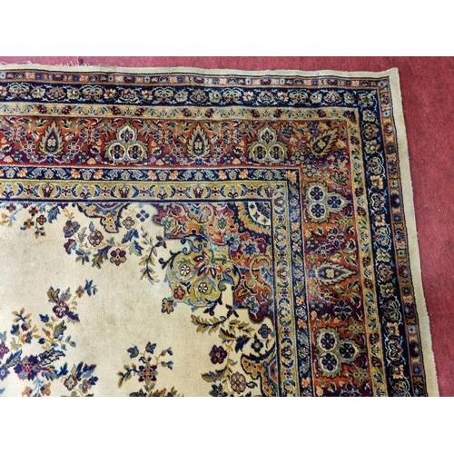 67 - A yellow ground Carpet with foliate decoration, stepped border, 362cm x 275cm.