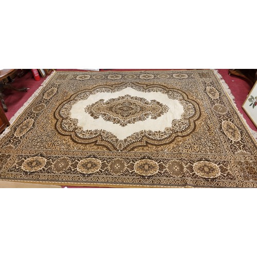 68 - A brown and cream ground Carpet with multi borders and allover decoration. 360 x 275cm approx.