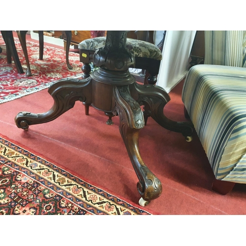 73 - A Victorian Walnut oval Supper Table with a highly veneered butt walnut top on a lovely carved quadr... 