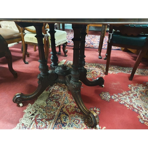 76 - A 19th Century Walnut bow fronted Supper Table on highly carved quatrefoil base. H 70 x D 88 x W 120... 