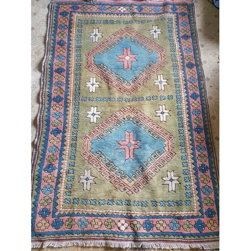 94 - A handwoven Turkish Kars Rug with a medallion design. 195 x 130cm approx.