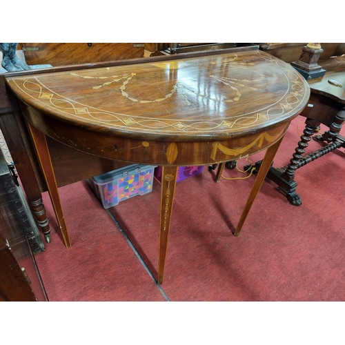 160 - A 19th Century bow fronted Mahogany Side/Serving Table profusely inlaid with bows and swags. 
H 85 x... 