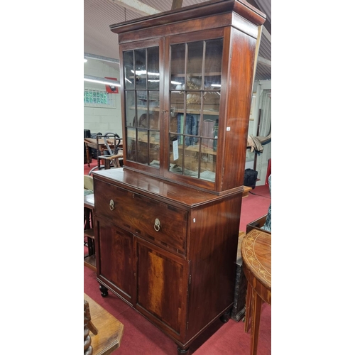 152 - A Georgian Mahogany Secretaire Bookcase with twin doors lions head handles and cornice top. H 224 x ... 