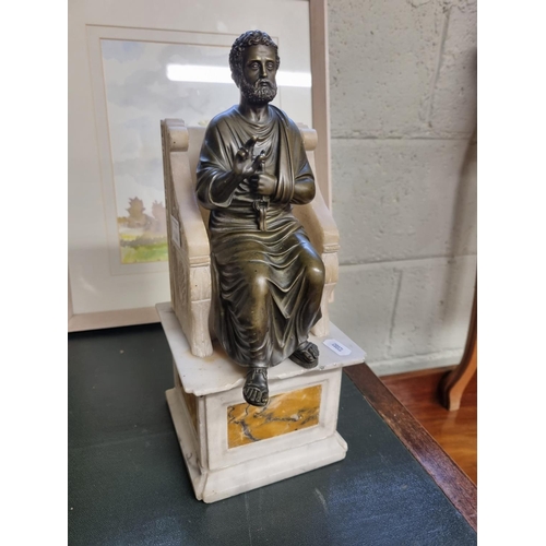 144 - A 19th Century Bronze figure of a Scribe sitting on a marble seat. H 33 cm approx.